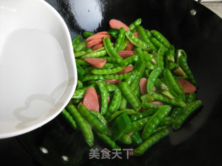 火腿炒豌豆荚的做法步骤：7