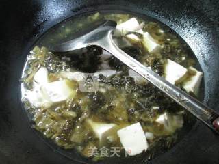 猪肉酸菜豆腐汤的做法步骤：7