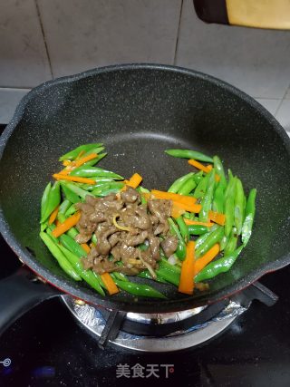 四季豆炒滑牛肉的做法步骤：11