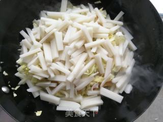 咸肉包菜炒年糕的做法步骤：7