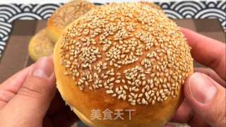 松软汉堡胚，松软有弹性，入口浓浓奶香和芝麻香。的做法步骤：19